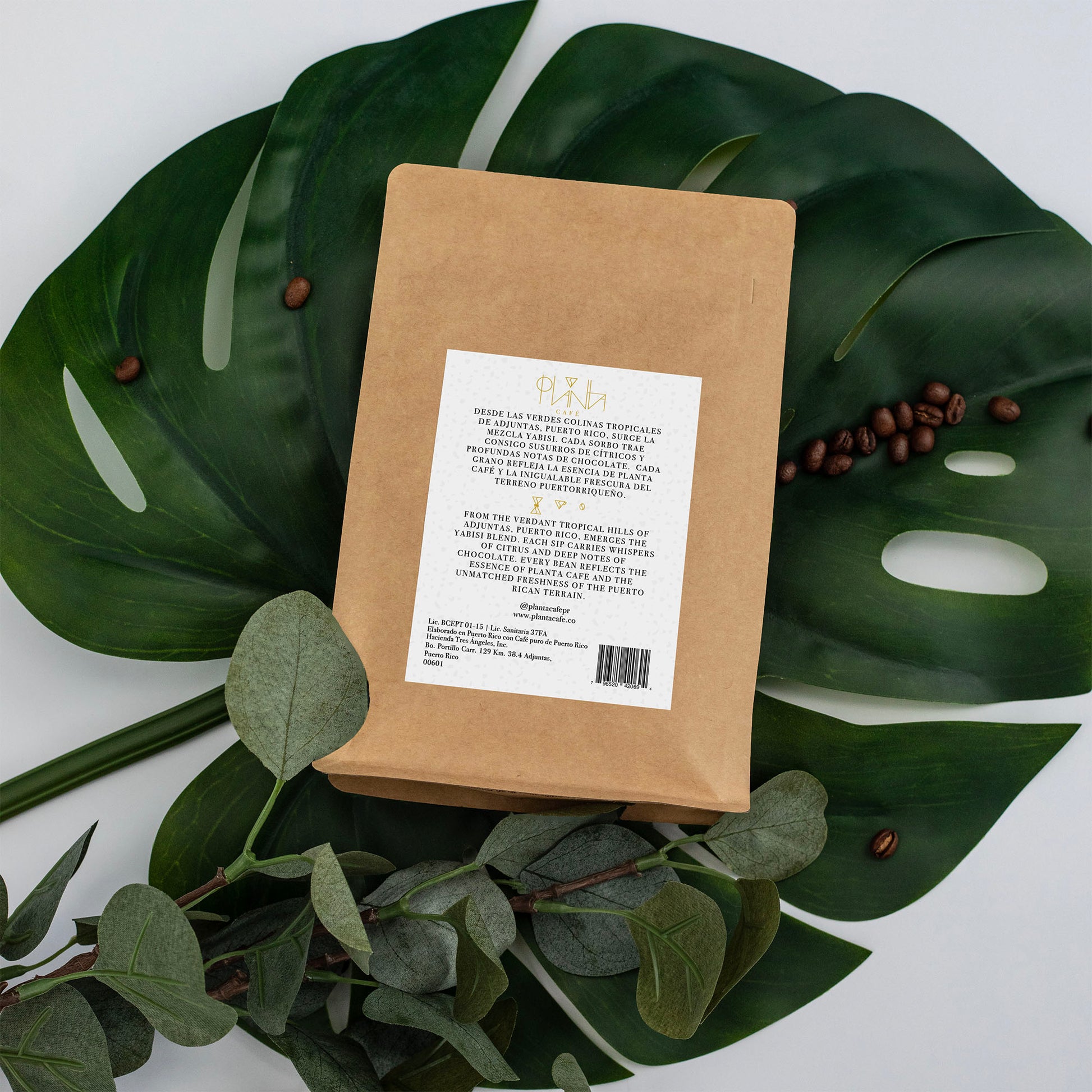 Yabisi Coffee Bag Back Label on a Green Leaf